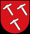 Das Wappen wurde zuletzt 1956 vom Nordrhein-Westfälischen Innenminister verliehen. Es ist abgeleitet vom Wappen der Herren von Schmidtheim, wie es sich am Schloss Schmidtheim befindet. Zugleich symbolisiert es die Eisenindustrie der Gemeinde.